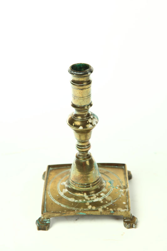 Appraisal: BRASS CANDLESTICK European th century Heavy baluster stem on square