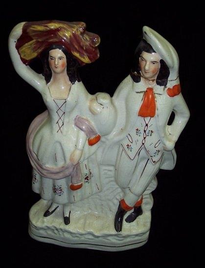 Appraisal: A Staffordshire flatback of a couple the female figure with