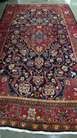 Appraisal: x Mahal Rug navy field with wine red medallion and