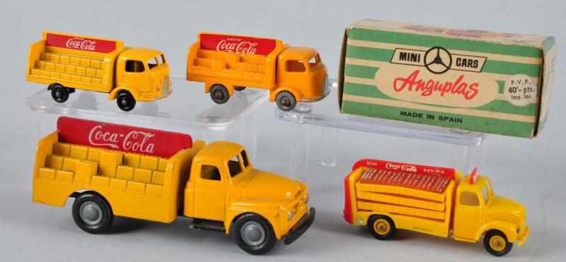 Appraisal: Lot of Assorted Coca-Cola Truck Toys Description Includes an Anguplas