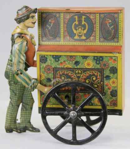 Appraisal: PETER THE ORGAN GRINDER Distler lithographed tin figure pushes organ