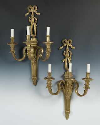 Appraisal: A Pair of Heavy Cast Brass Electrified Wall Sconces The