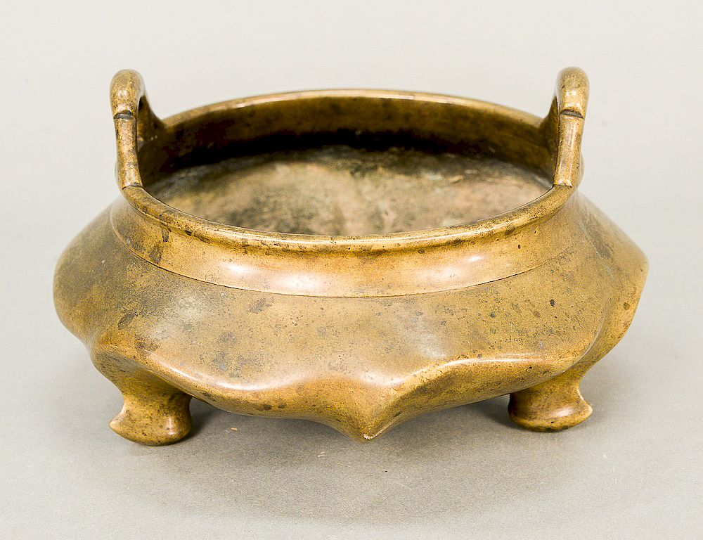 Appraisal: Bronze tripod censer with loop handles on a squat ding