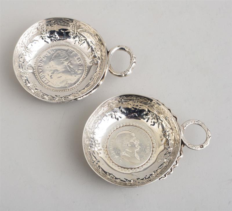 Appraisal: TWO FRENCH COIN-MOUNTED SILVER WINE TASTERS One centered by Louis