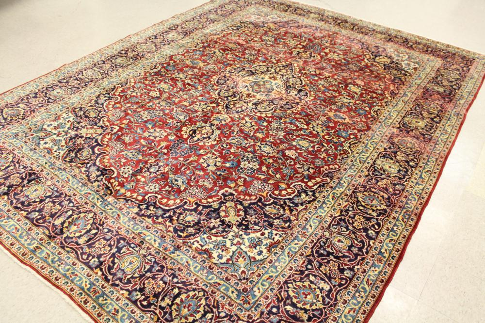 Appraisal: HAND KNOTTED PERSIAN CARPET floral and central floral medallion design