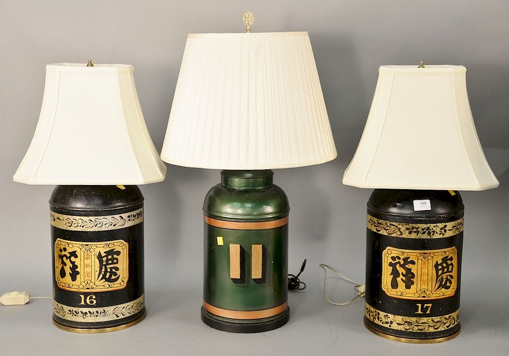 Appraisal: Three told lamps to include Oriental pair of black lamps