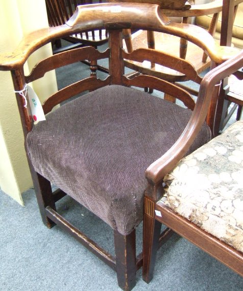 Appraisal: A George II beech and fruitwood corner chair with double