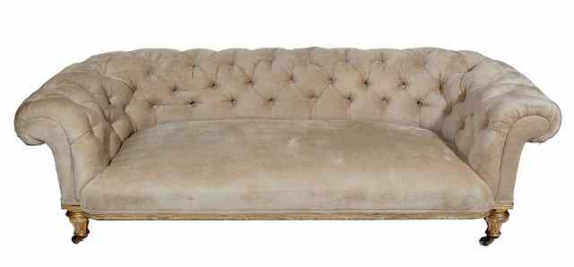 Appraisal: A VICTORIAN BUTTON UPHOLSTERED CHESTERFIELD SOFA with gilt frame standing