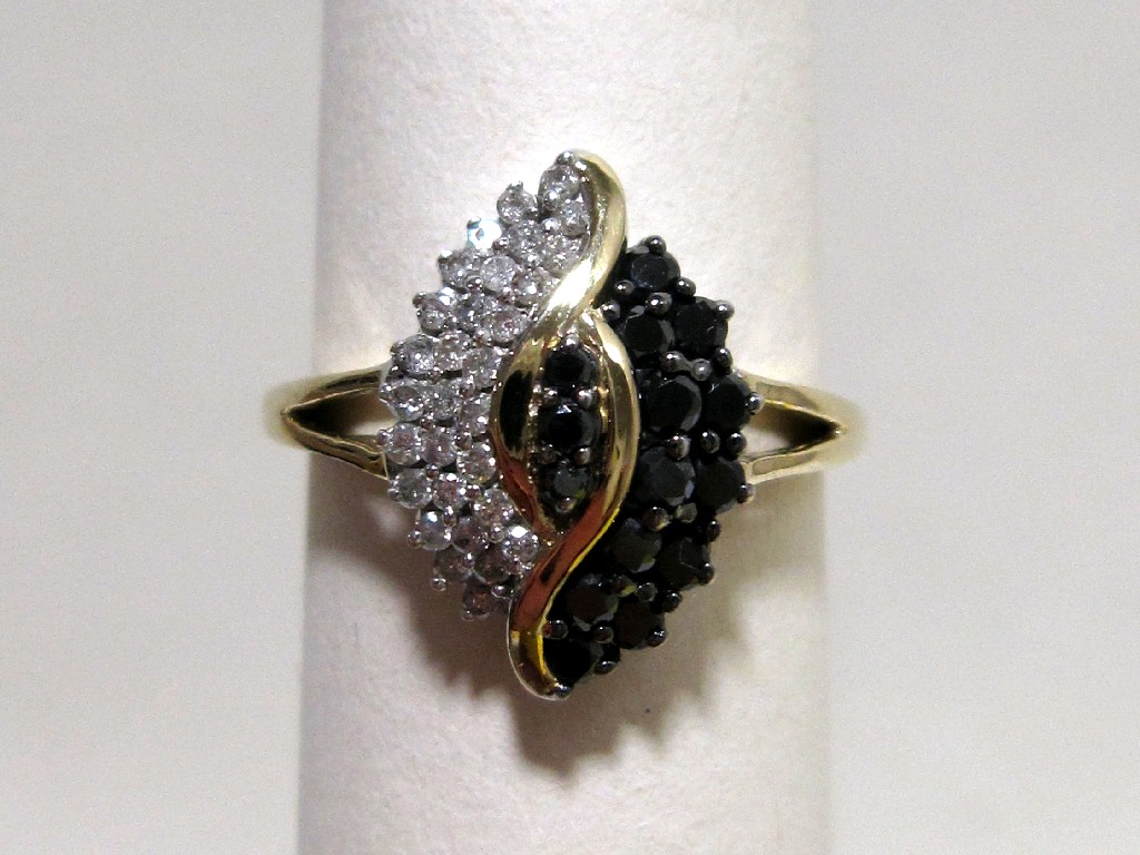 Appraisal: Gold black and white diamond cluster ring