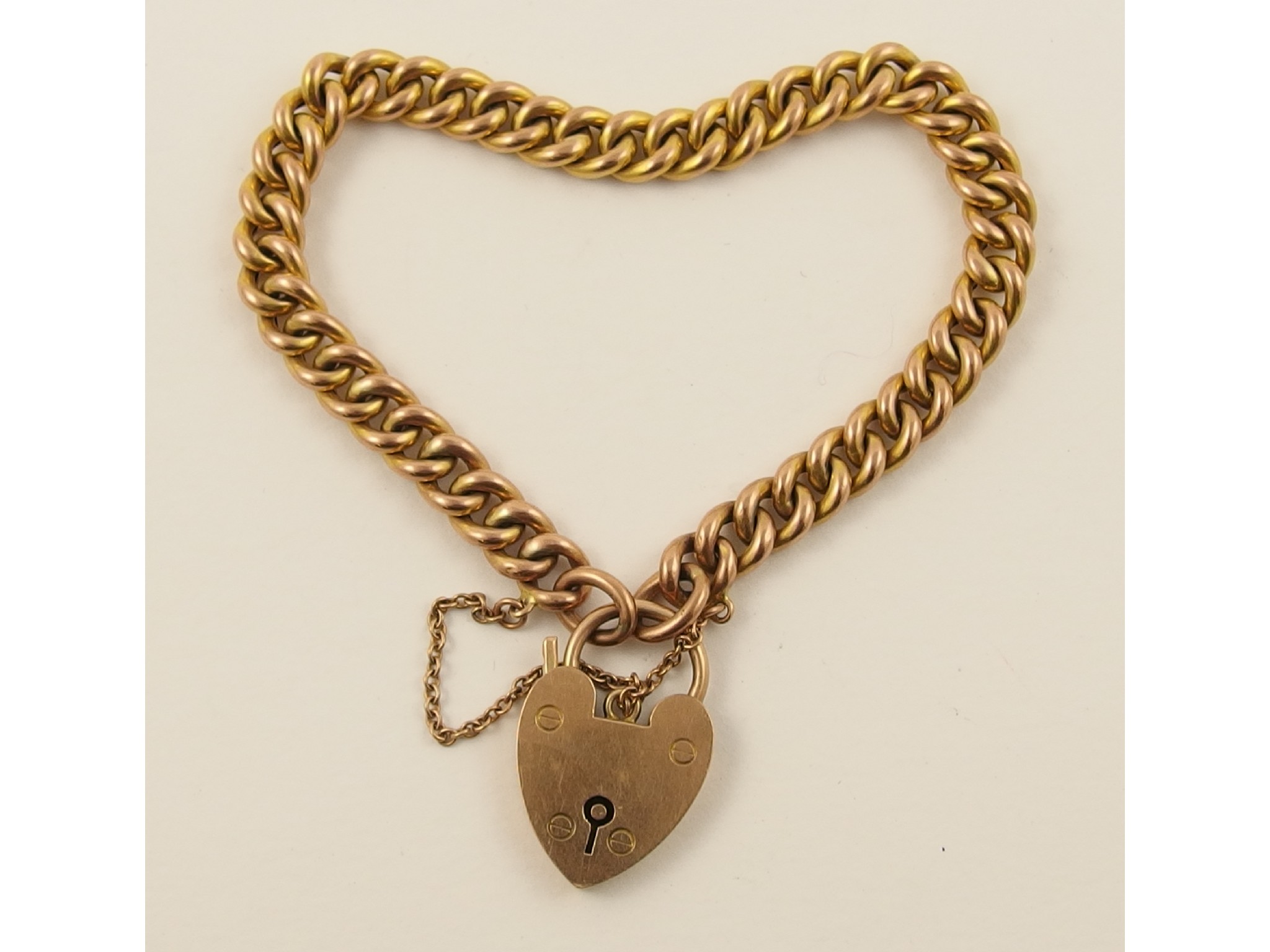 Appraisal: A ct curb link bracelet with heart clasp approx gms