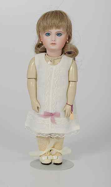 Appraisal: French Reproduction Jumeau Doll French a reproduction bisque head doll