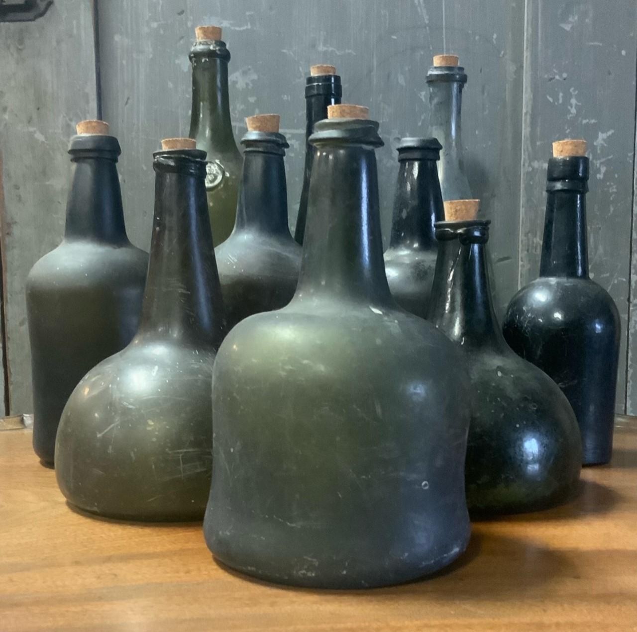 Appraisal: TH TH C GLASS BOTTLES Two early onion bottles H