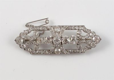 Appraisal: A diamond set plaque brooch The open work brooch centred