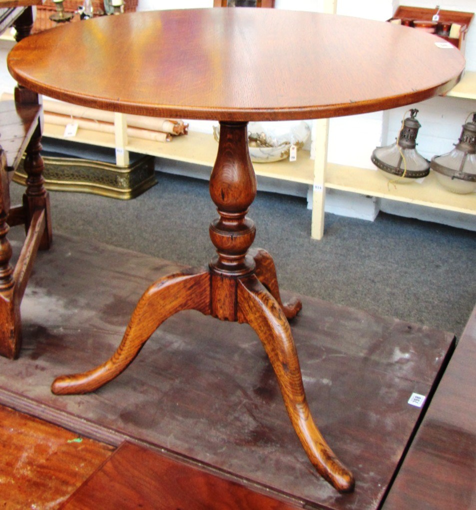 Appraisal: A th century circular oak tripod table cm wide together