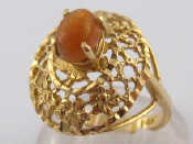 Appraisal: A yellow metal fire opal ring marked k ring size