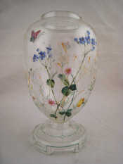 Appraisal: An ovoid glass vase the surface with enamelled flowers and