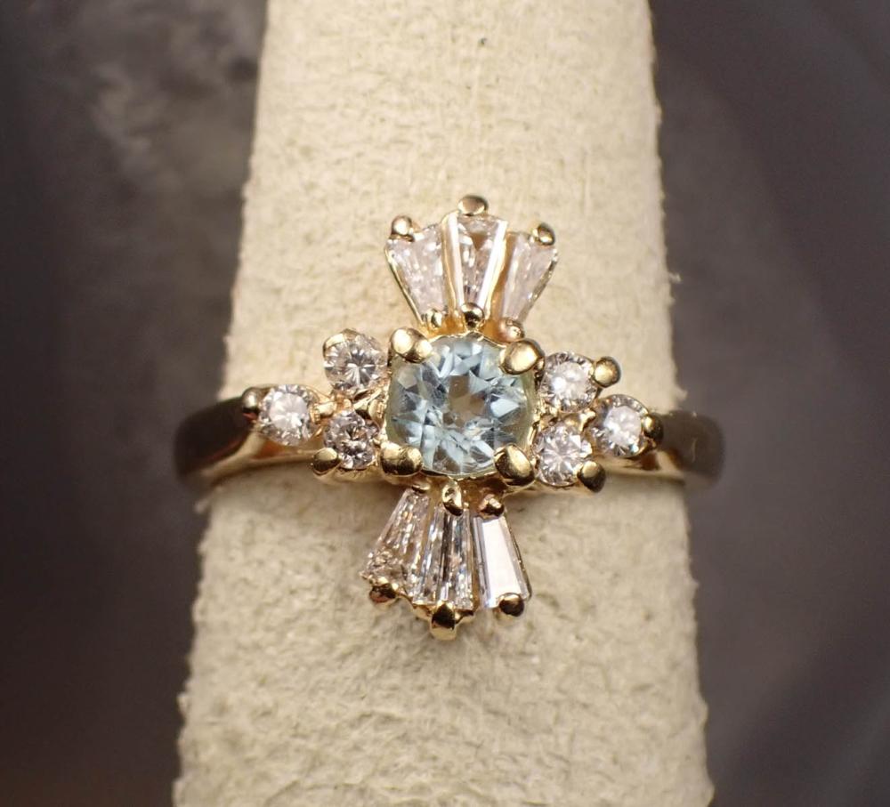 Appraisal: BLUE TOPAZ DIAMOND AND FOURTEEN KARAT GOLD RING The yellow