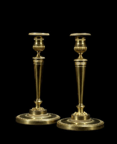 Appraisal: A pair of French early th century Empire gilt-bronze candlesticks