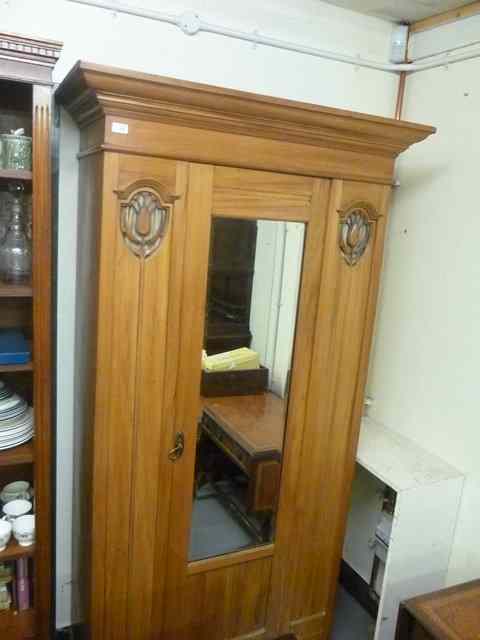 Appraisal: A LATE VICTORIAN ART NOUVEAU STYLE WARDROBE with single mirrored