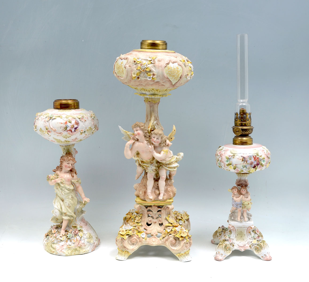 Appraisal: DRESDEN STYLE FIGURAL OIL LAMPS Dresden style porcelain oil lamps