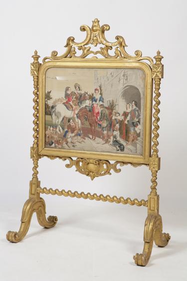 Appraisal: A VICTORIAN GILTWOOD FIRE SCREEN the shaped screen with a