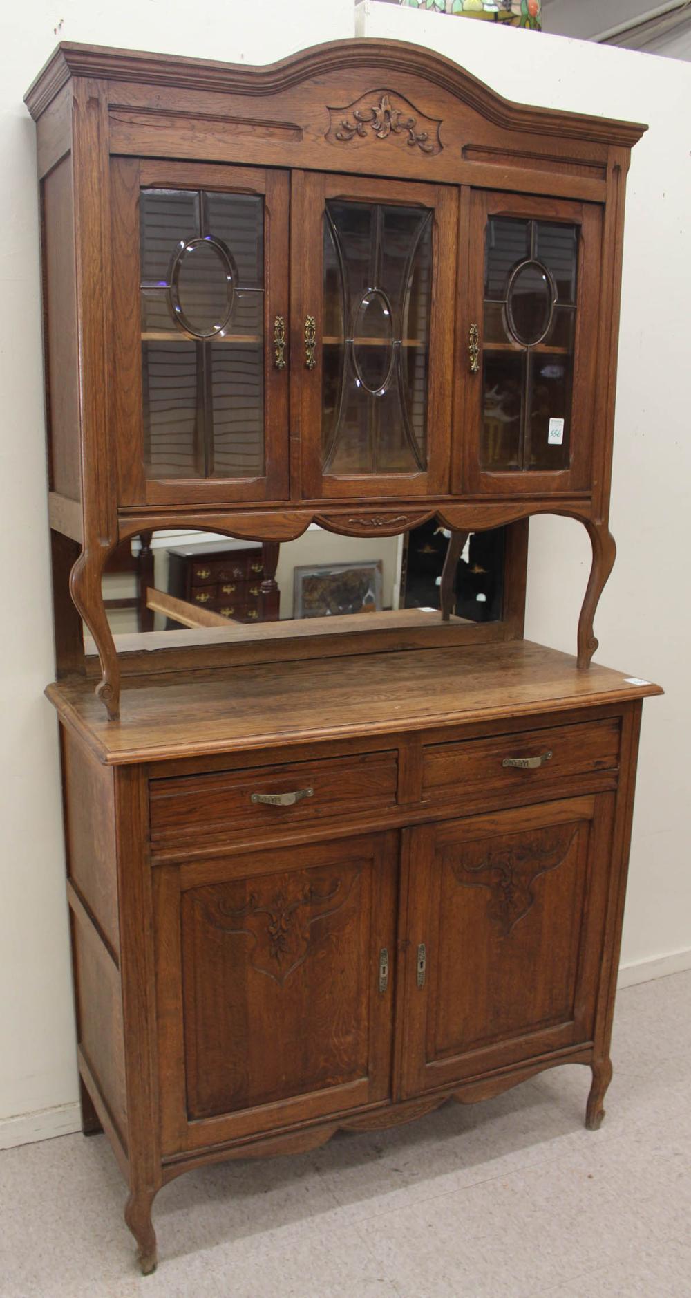 Appraisal: TWO-PIECE CARVED OAK SIDEBOARD Belgian c the top section a