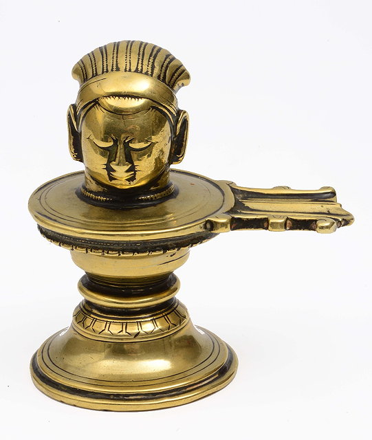 Appraisal: An Indian bronze ceremonial candle holder th Centurythe head in