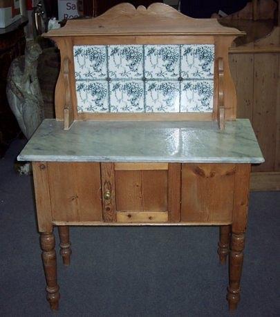 Appraisal: An Edwardian tiled back washstand on turned legs cm wide