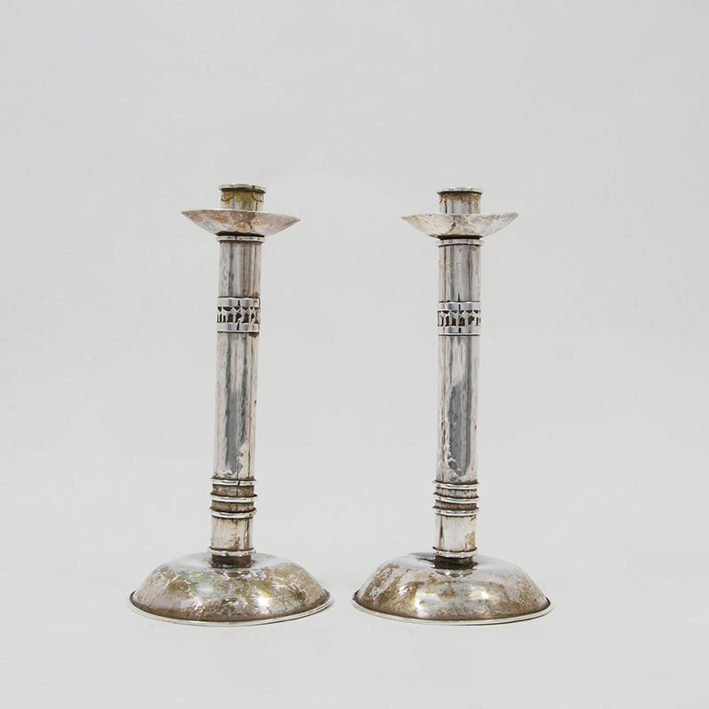 Appraisal: PAIR HANDMADE SILVER ISRAELI CANDLESTICKS Hand hammered with ring on