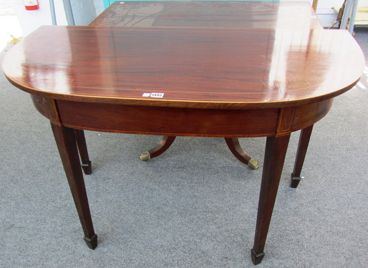 Appraisal: A George III mahogany bow front side table on tapering