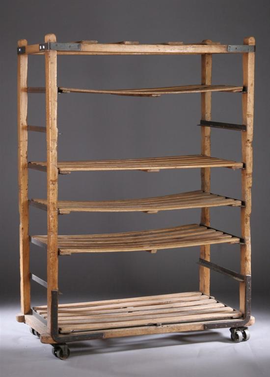 Appraisal: FRENCH PROVINCIAL MIXED WOOD ROLLING BAKER'S RACK early th century