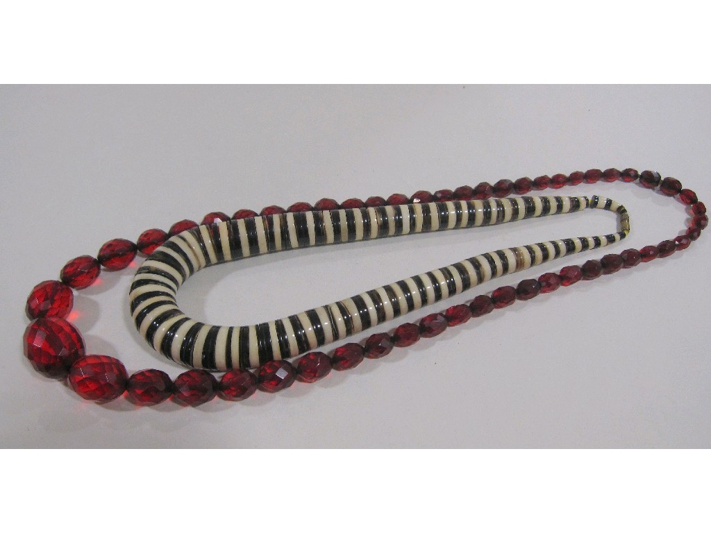 Appraisal: Lot comprising a string of horn and ivorine beads and