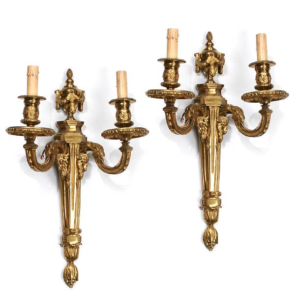 Appraisal: A pair of Louis XVI style gilt bronze two light