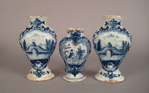 Appraisal: Pair of Delft blue and white garnitures ca decorated with