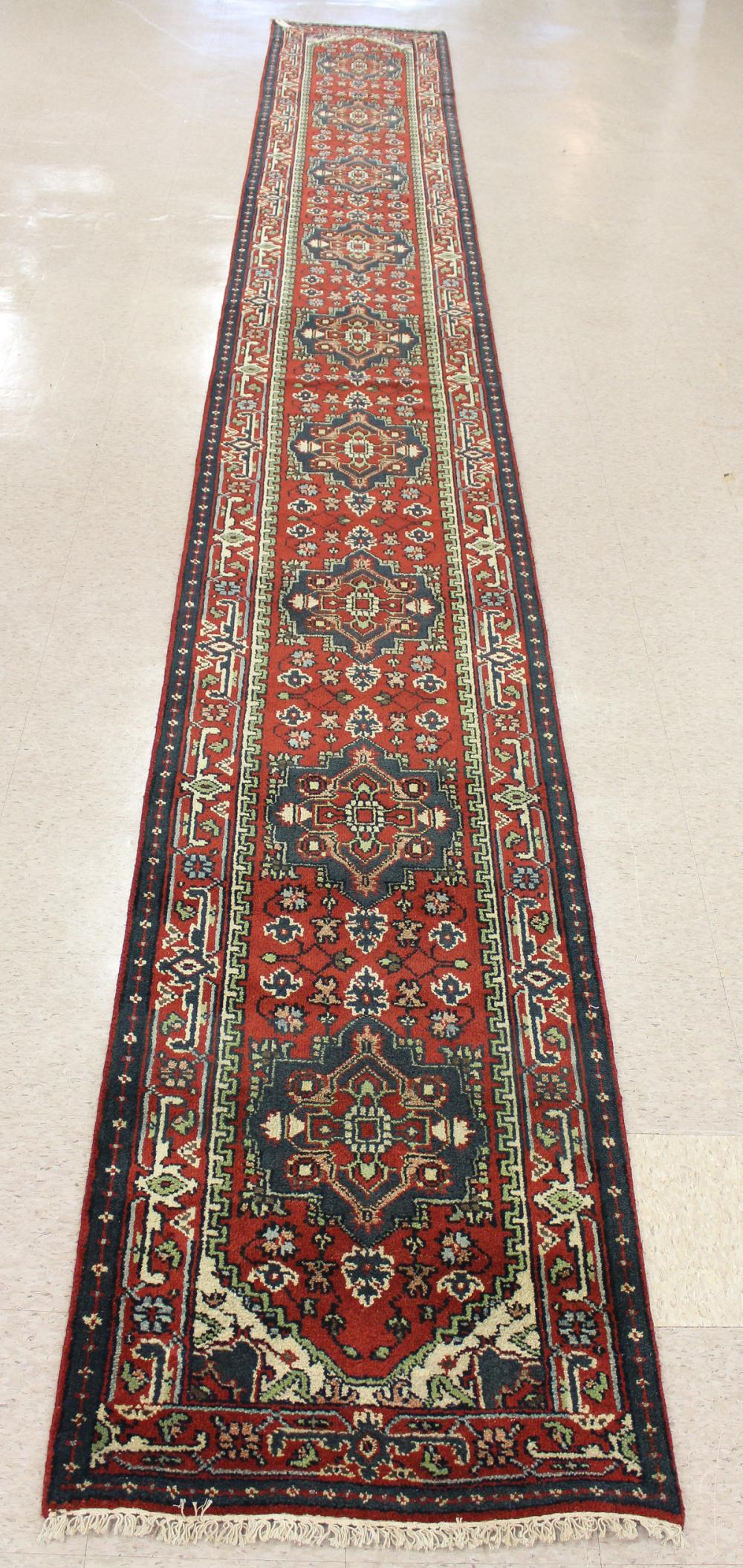 Appraisal: HAND KNOTTED ORIENTAL LONG RUG Persian Serab design having nine