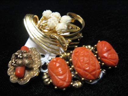 Appraisal: Three gold pins Two with coral designs one with small