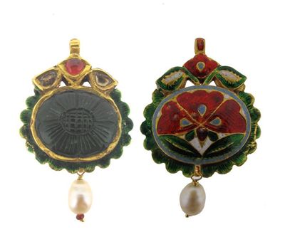 Appraisal: An Indian carved oval emerald pendant Set with two rose