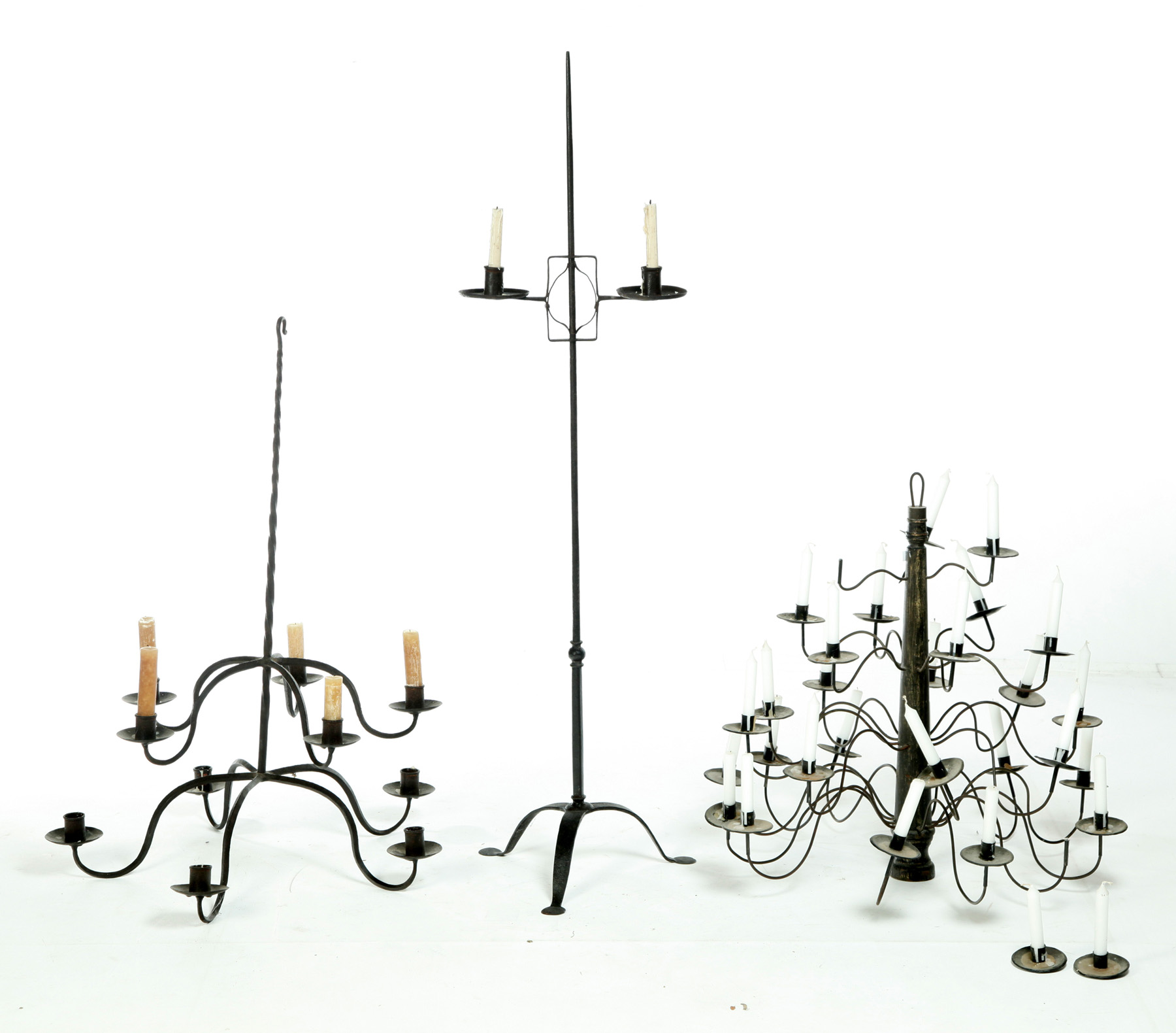 Appraisal: THREE LIGHTING DEVICES Twentieth century Includes a wrought-iron floorstanding adjustable