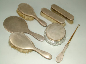 Appraisal: A seven piece silver mounted dressing table set Mappin and