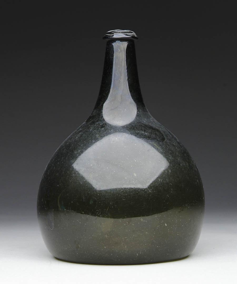 Appraisal: FREE BLOWN GREEN BOTTLE Early bottle of bulbous form with