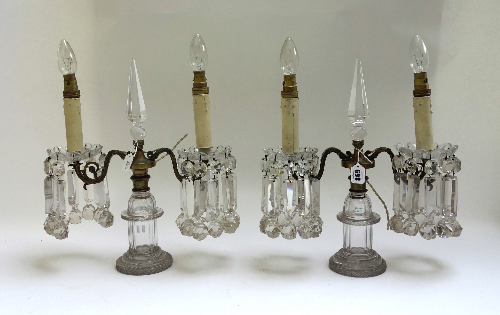 Appraisal: A pair of Victorian glass twin light lustres the central