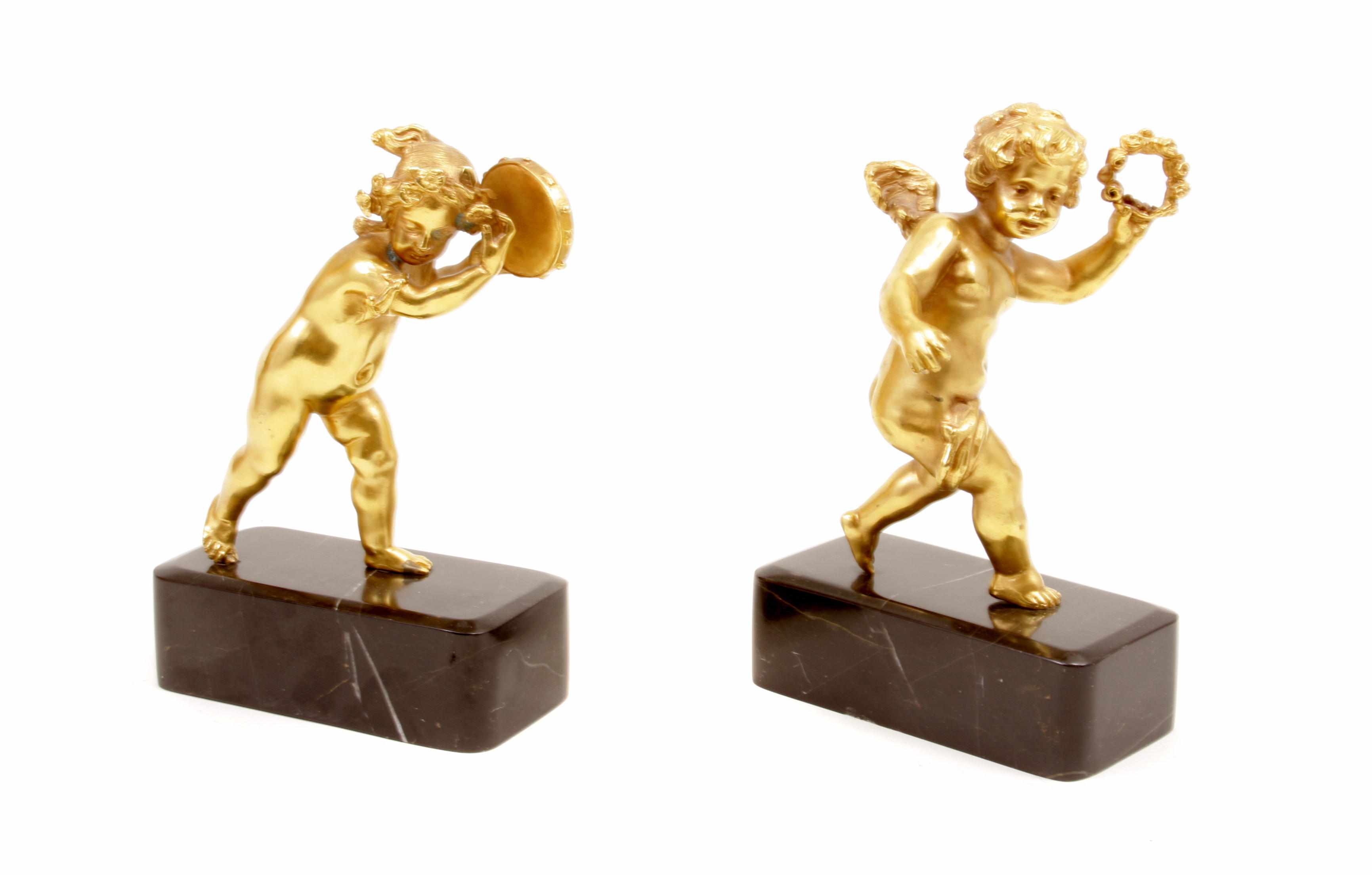 Appraisal: A pair of French gilt bronze figures of putti on