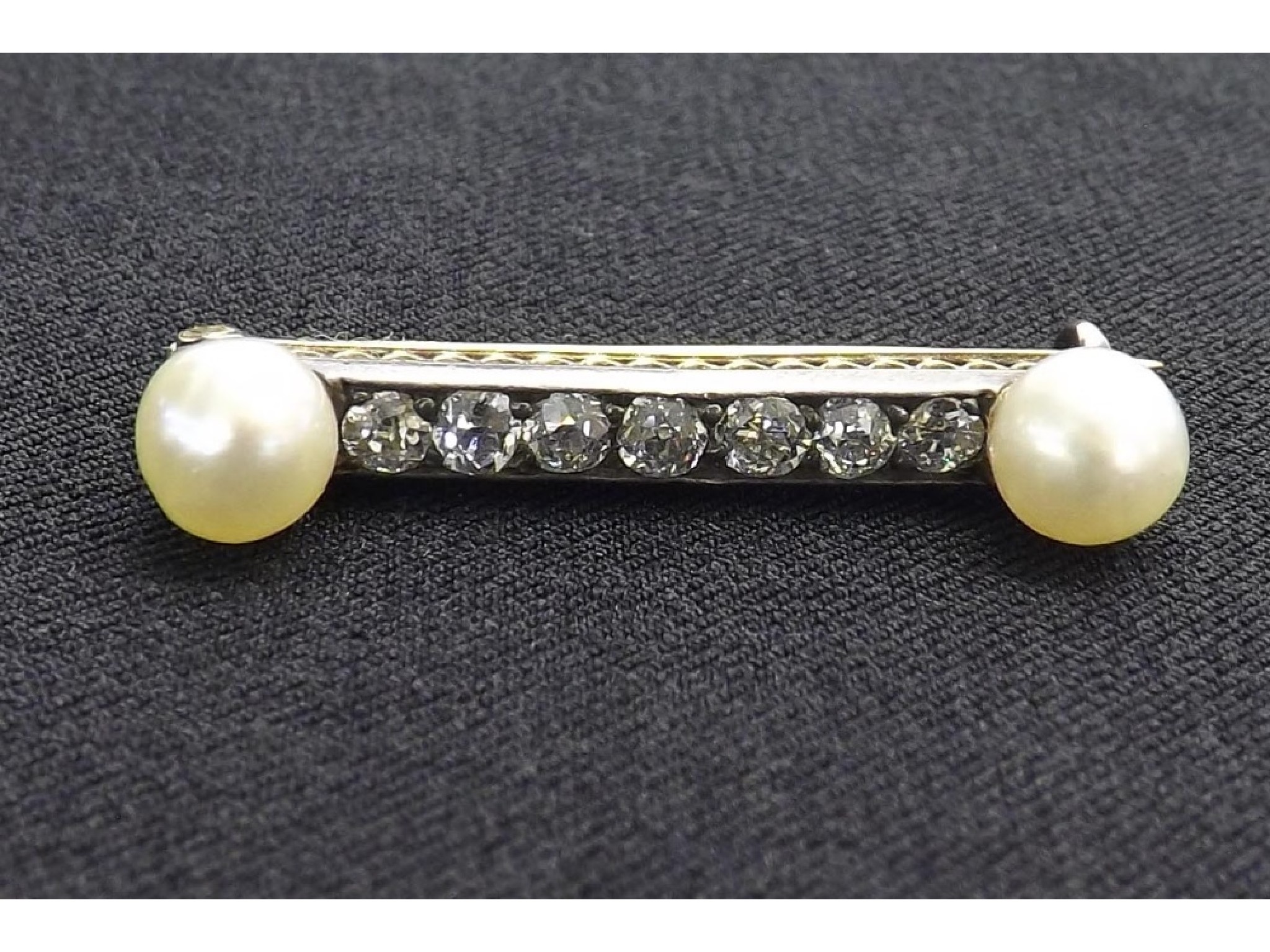 Appraisal: Diamond and cultured pearl bar brooch with seven old-cut diamonds