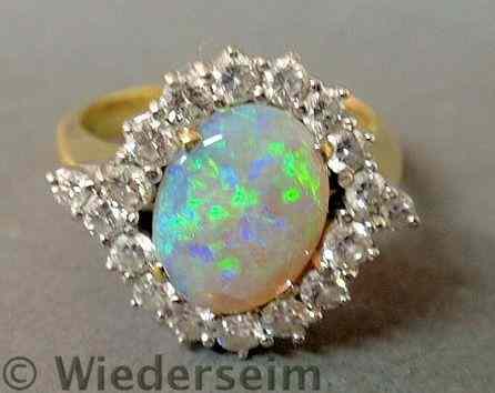 Appraisal: Opal and diamond k yg ring with a center oval