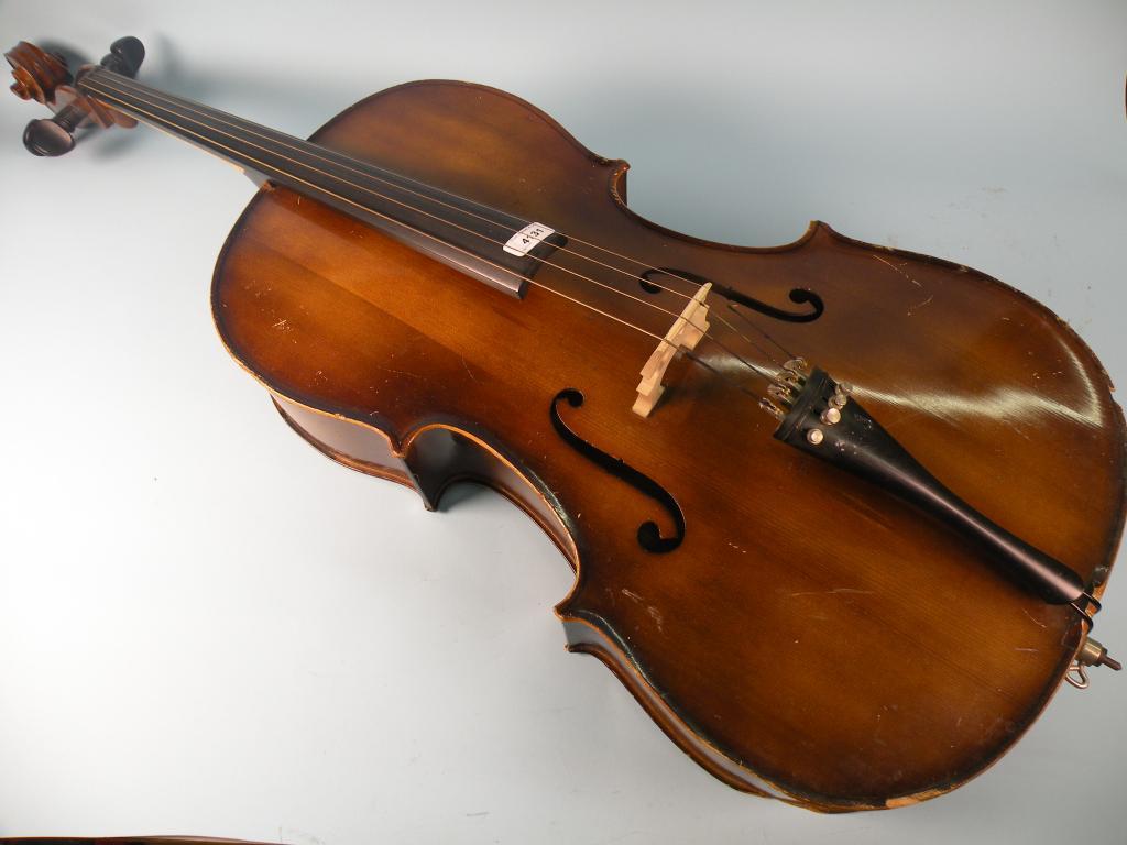 Appraisal: A Hungarian cello with a carved scroll and ebonised finger