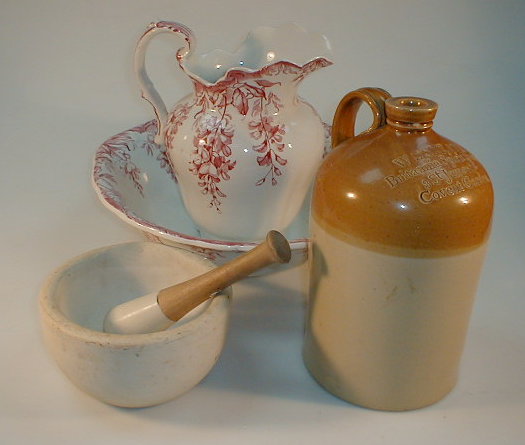 Appraisal: Pestle and mortar floral jug and bowl set and a