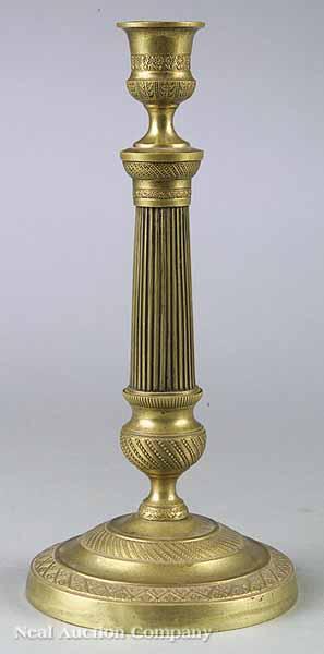 Appraisal: A Neo-Classical-Style Cast Brass Candlestick late th c the reeded