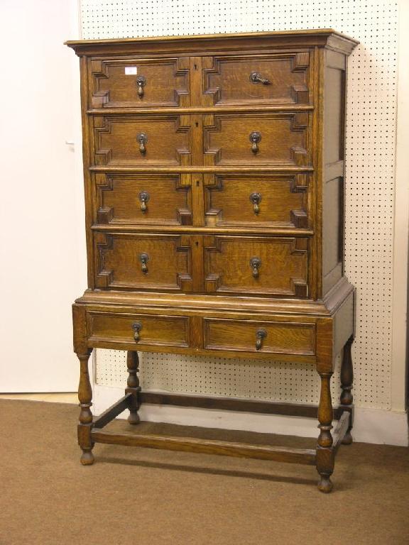 Appraisal: A solid medium oak chest on stand upper stage with