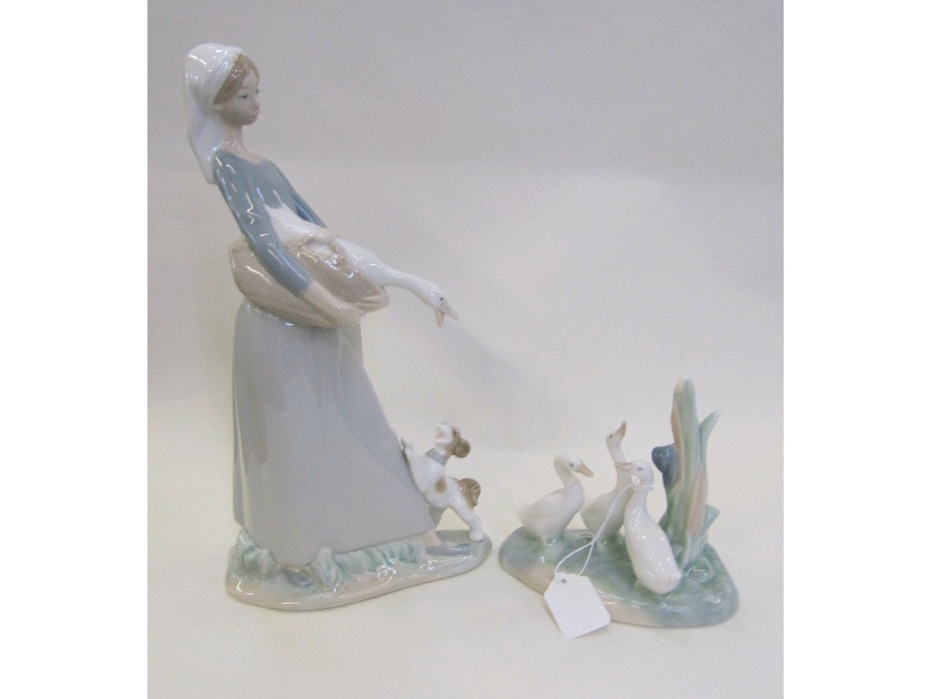 Appraisal: Lladro figure of a girl carrying a goose and a