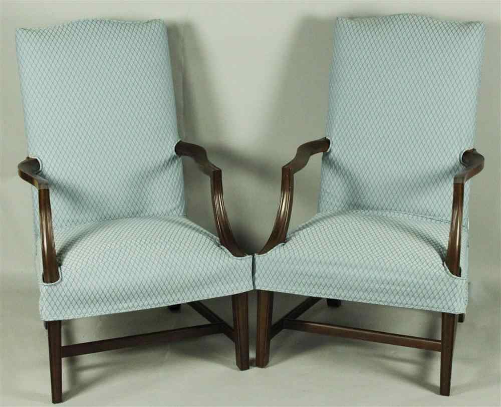 Appraisal: PAIR GEORGIAN STYLE MAHOGANY LOLLING CHAIRS each having a shaped